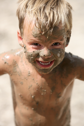 Photo of boy playing in mud Photo of boy playing in mud