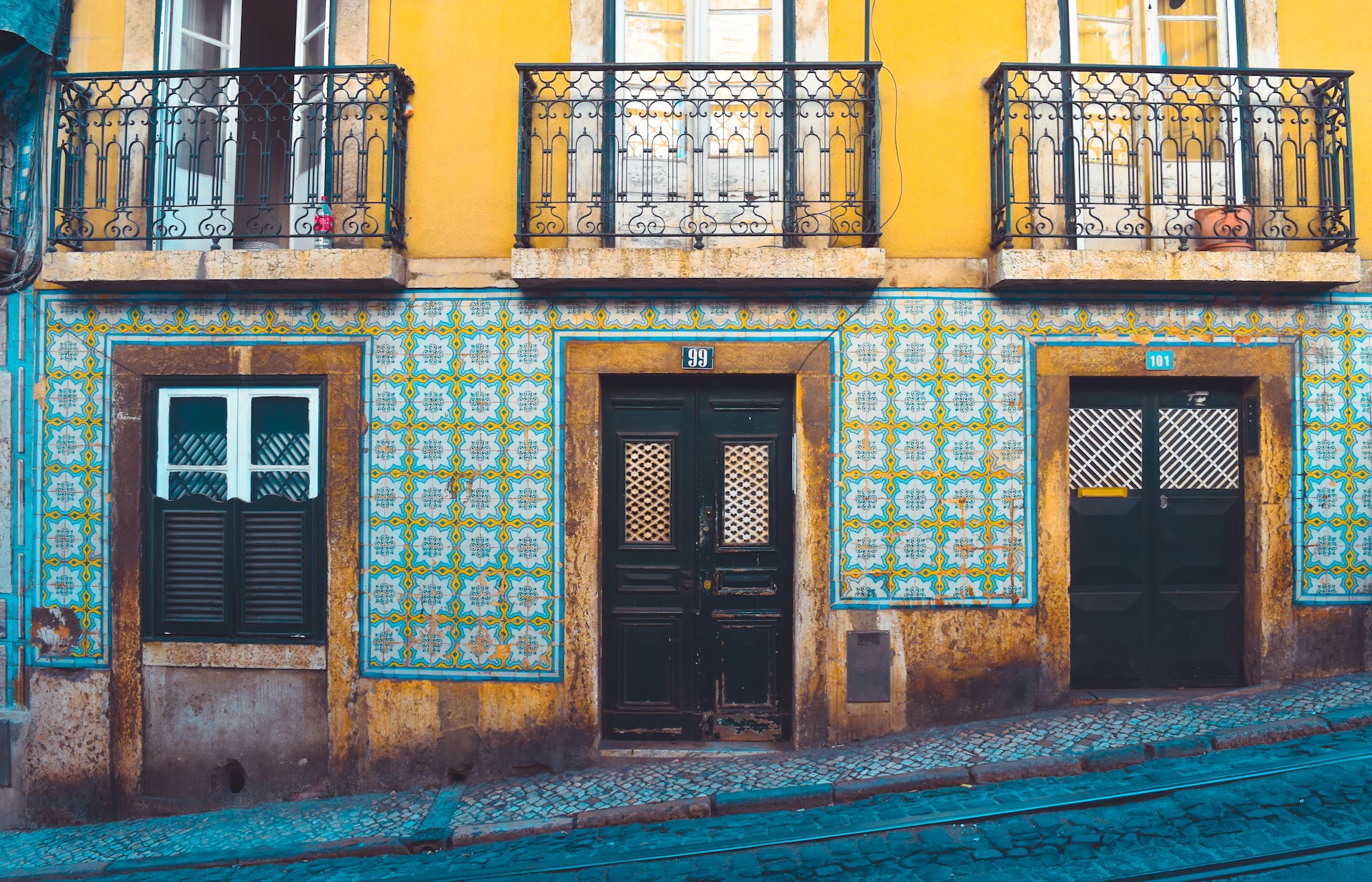 A street view of a tiled building on a steep incline. A street view of a tiled building on a steep incline.